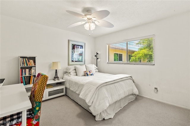 1345 SE 40th Ter Unit 2D, Cape Coral, FL 33904 - bedroom with light colored carpet and ceiling fan