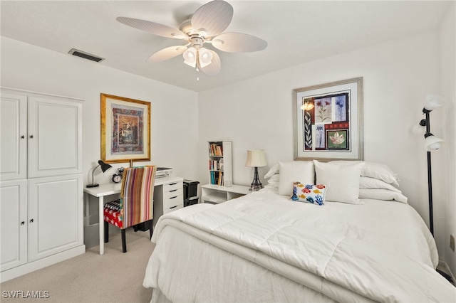 1345 SE 40th Ter Unit 2D, Cape Coral, FL 33904 - bedroom featuring light colored carpet and ceiling fan
