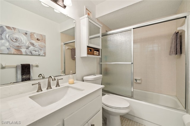 1345 SE 40th Ter Unit 2D, Cape Coral, FL 33904 - bathroom with toilet, vanity, enclosed tub / shower combo, and tile patterned flooring