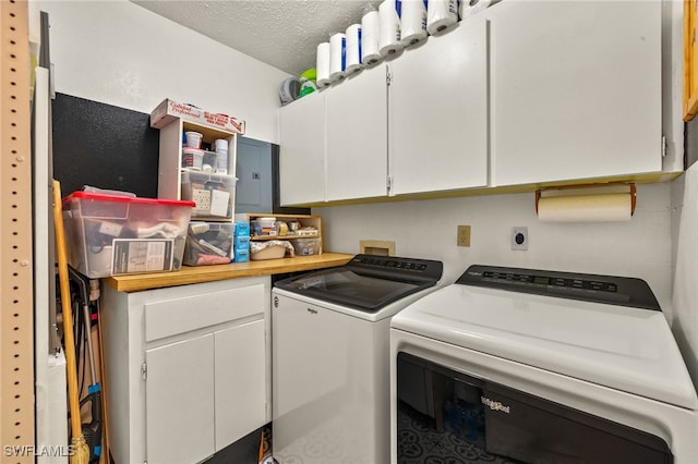 1345 SE 40th Ter Unit 2D, Cape Coral, FL 33904 - laundry room with washing machine and clothes dryer, cabinet space, and a textured ceiling