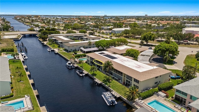 1345 SE 40th Ter Unit 2D, Cape Coral, FL 33904 - aerial view of a nearby body of water and a pool area
