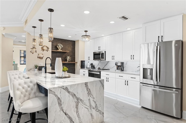5793 Cape Harbour Dr Unit 1119, Cape Coral, FL 33914 - kitchen with stainless steel appliances, light marble finish floors, decorative backsplash, recessed lighting, and ornamental molding