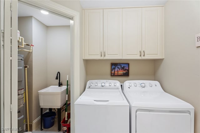5793 Cape Harbour Dr Unit 1119, Cape Coral, FL 33914 - washroom with washing machine and clothes dryer, cabinet space, and electric water heater