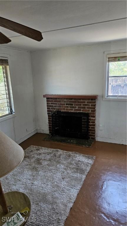 27625 Michigan St, Bonita Springs, FL 34135 - unfurnished living room with a brick fireplace and plenty of natural light
