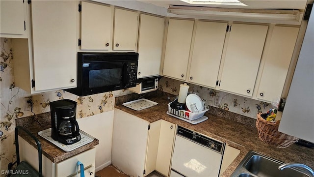 27625 Michigan St, Bonita Springs, FL 34135 - kitchen with black microwave, white dishwasher, cream cabinetry, backsplash, and dark countertops