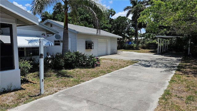 27625 Michigan St, Bonita Springs, FL 34135 - view of home's exterior with driveway and a garage