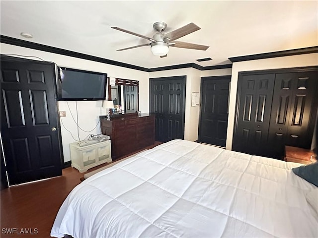 352 Paisley Ave, Lehigh Acres, FL 33974 - bedroom with ornamental molding, multiple closets, ceiling fan, and wood finished floors