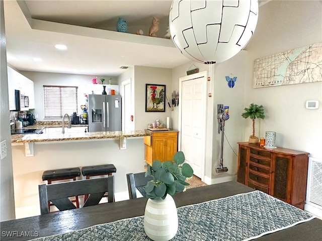 352 Paisley Ave, Lehigh Acres, FL 33974 - dining space featuring recessed lighting