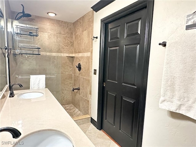 352 Paisley Ave, Lehigh Acres, FL 33974 - bathroom with tiled shower, double vanity, and tile patterned flooring