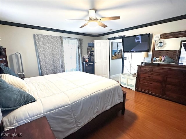352 Paisley Ave, Lehigh Acres, FL 33974 - bedroom featuring wood finished floors, ornamental molding, and ceiling fan