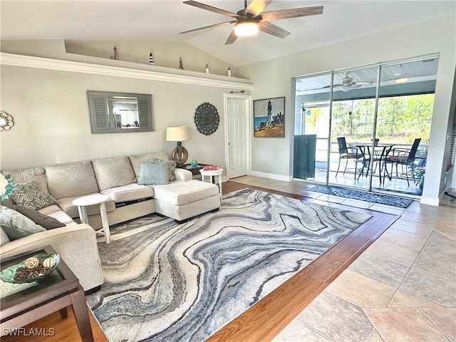 352 Paisley Ave, Lehigh Acres, FL 33974 - living room with a ceiling fan, lofted ceiling, and tile patterned flooring