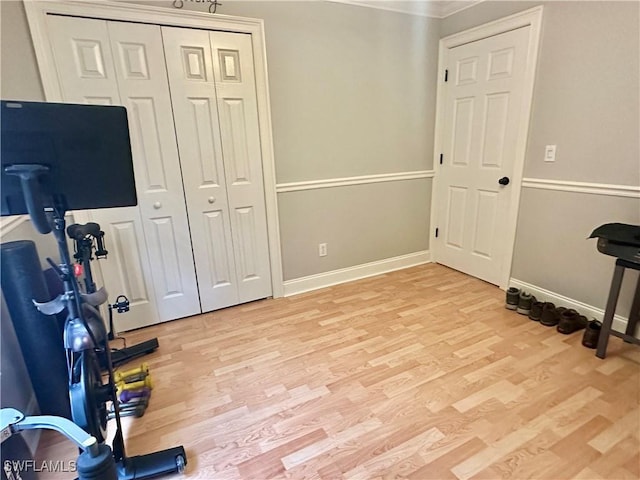 352 Paisley Ave, Lehigh Acres, FL 33974 - workout area featuring light wood finished floors and crown molding