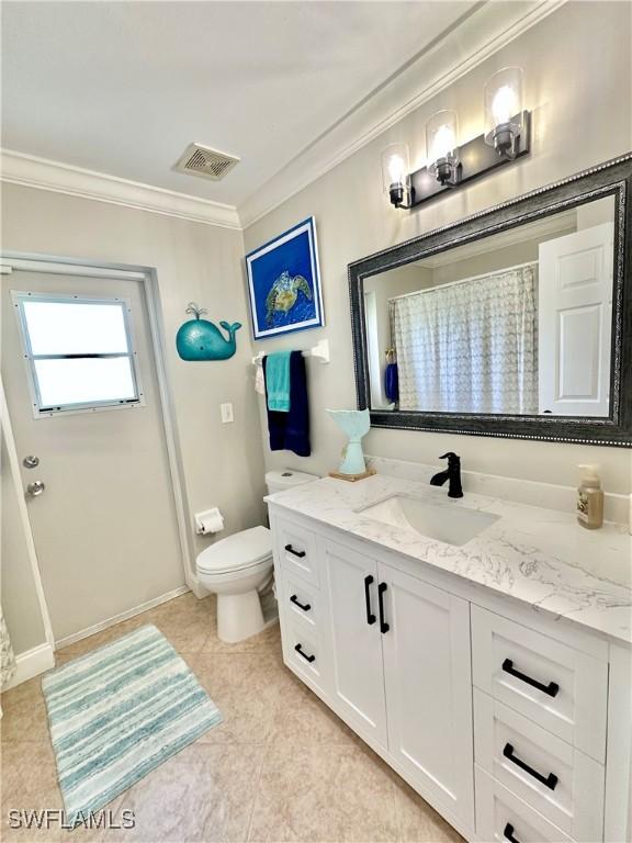 352 Paisley Ave, Lehigh Acres, FL 33974 - full bathroom with ornamental molding, vanity, tile patterned flooring, and a shower with shower curtain