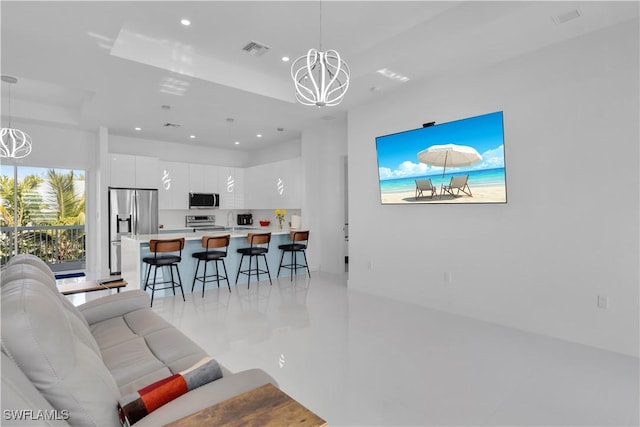 518 Avenida Primiceria, Marathon, FL 33050 - living room with a chandelier, recessed lighting, and a tray ceiling
