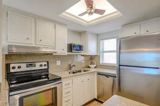 5000 Estero Blvd Unit 202, Fort Myers Beach, FL 33931 - kitchen with appliances with stainless steel finishes, under cabinet range hood, a sink, white cabinetry, and tasteful backsplash