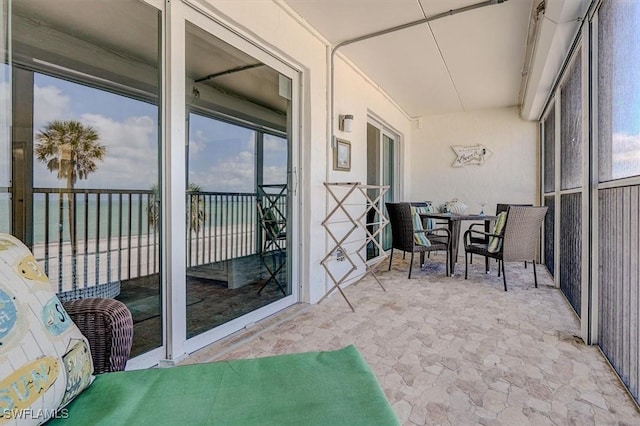 5000 Estero Blvd Unit 202, Fort Myers Beach, FL 33931 - sunroom / solarium with outdoor dining area