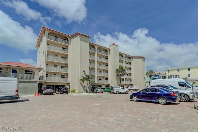 5000 Estero Blvd Unit 202, Fort Myers Beach, FL 33931 - view of building exterior featuring uncovered parking