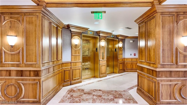 4021 Gulf Shore Blvd N Unit 1704, Naples, FL 34103 - hall with inlaid floor details, a decorative wall, elevator, recessed lighting, and a wainscoted wall