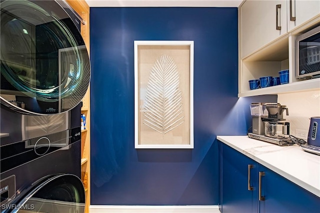 4021 Gulf Shore Blvd N Unit 1704, Naples, FL 34103 - laundry area with stacked washer / drying machine