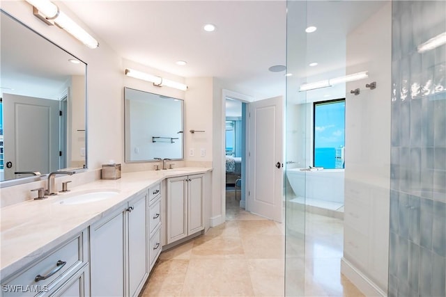 4021 Gulf Shore Blvd N Unit 1704, Naples, FL 34103 - ensuite bathroom with double vanity, walk in shower, and recessed lighting