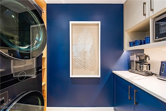 4021 Gulf Shore Blvd N Unit 1704, Naples, FL 34103 - washroom featuring stacked washing machine and dryer