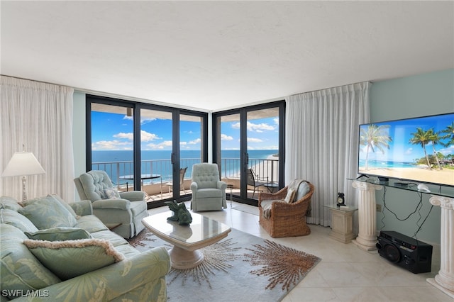 300 S Collier Blvd Unit 2304, Marco Island, FL 34145 - living area featuring light tile patterned floors and floor to ceiling windows