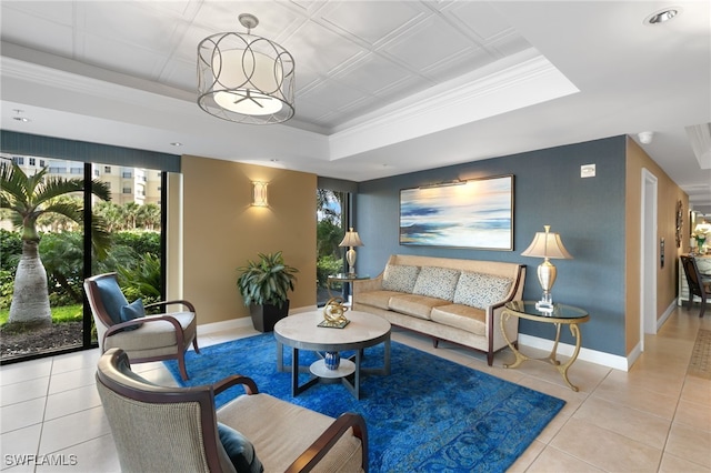 300 S Collier Blvd Unit 2304, Marco Island, FL 34145 - living room with a tray ceiling, plenty of natural light, baseboards, light tile patterned flooring, and ornamental molding
