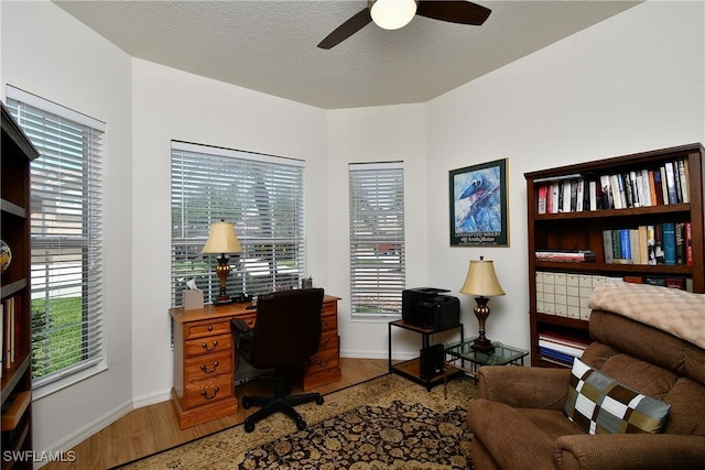 2842 Via Piazza Loop, Fort Myers, FL 33905 - office area with wood finished floors, a ceiling fan, and plenty of natural light