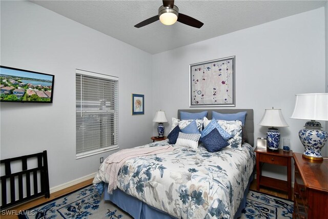2842 Via Piazza Loop, Fort Myers, FL 33905 - bedroom featuring wood finished floors, baseboards, and ceiling fan