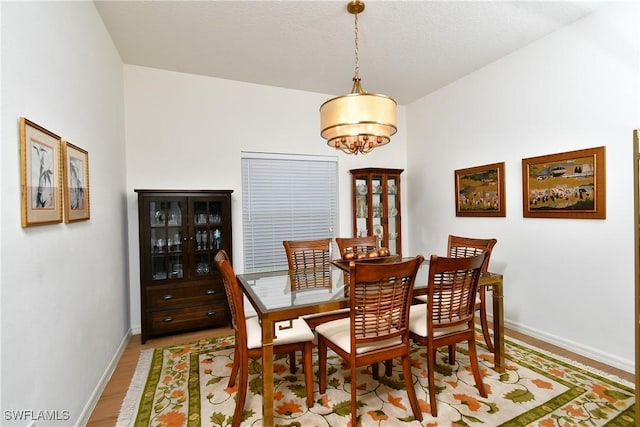 2842 Via Piazza Loop, Fort Myers, FL 33905 - dining room featuring baseboards and light wood finished floors