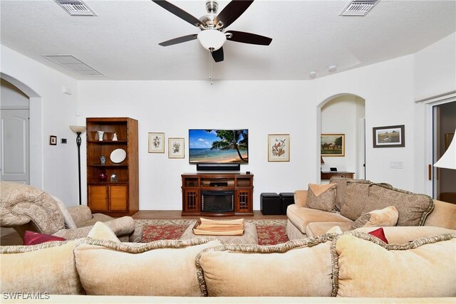 2842 Via Piazza Loop, Fort Myers, FL 33905 - living room featuring arched walkways and a ceiling fan