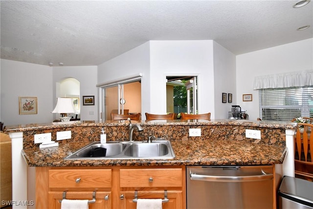 2842 Via Piazza Loop, Fort Myers, FL 33905 - kitchen with dishwasher, a sink, a textured ceiling, open floor plan, and healthy amount of natural light
