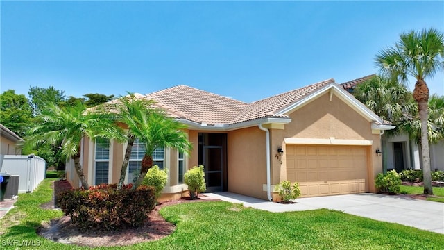 2842 Via Piazza Loop, Fort Myers, FL 33905 - view of front of house with an attached garage, stucco siding, driveway, and a tiled roof