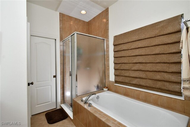 2842 Via Piazza Loop, Fort Myers, FL 33905 - full bathroom with a stall shower, a bath, and tile patterned floors