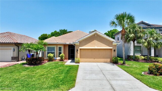 2842 Via Piazza Loop, Fort Myers, FL 33905 - single story home with an attached garage, stucco siding, a tile roof, and a front yard