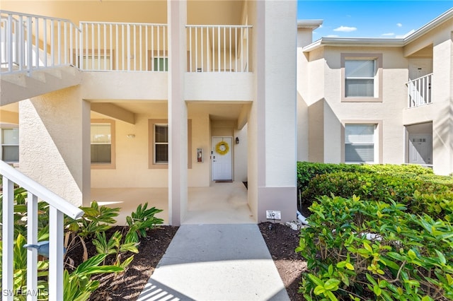 21360 Lancaster Run Unit 1514, Estero, FL 33928 - view of exterior entry with stucco siding