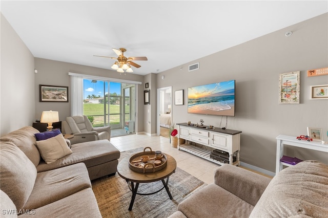 21360 Lancaster Run Unit 1514, Estero, FL 33928 - living room featuring light tile patterned flooring, ceiling fan, and baseboards
