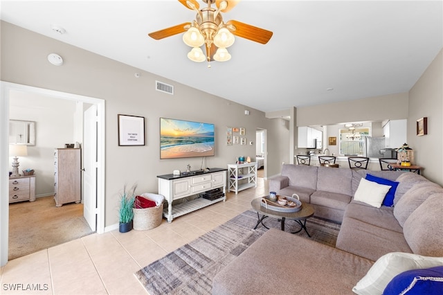 21360 Lancaster Run Unit 1514, Estero, FL 33928 - living room with ceiling fan, light tile patterned floors, a chandelier, baseboards, and light colored carpet