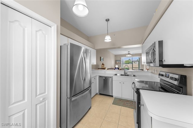 21360 Lancaster Run Unit 1514, Estero, FL 33928 - kitchen with appliances with stainless steel finishes, a sink, light countertops, white cabinetry, and light tile patterned floors