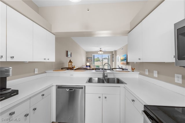 21360 Lancaster Run Unit 1514, Estero, FL 33928 - kitchen featuring appliances with stainless steel finishes, a sink, light countertops, white cabinets, and ceiling fan
