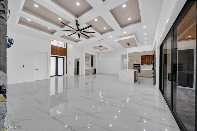13 NW 14th Ave, Cape Coral, FL 33993 - unfurnished living room featuring coffered ceiling, beamed ceiling, a towering ceiling, french doors, and light marble finish floors