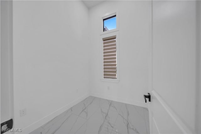 13 NW 14th Ave, Cape Coral, FL 33993 - empty room with marble finish floors and baseboards