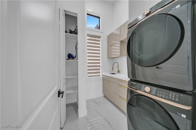 13 NW 14th Ave, Cape Coral, FL 33993 - clothes washing area with estacked washer and dryer and light marble finish flooring