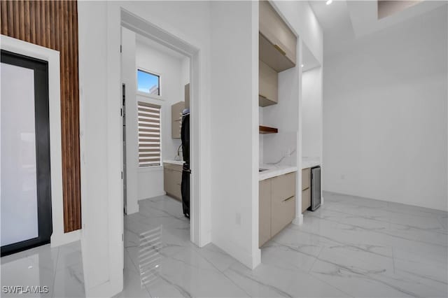 13 NW 14th Ave, Cape Coral, FL 33993 - hallway featuring light marble finish flooring and baseboards