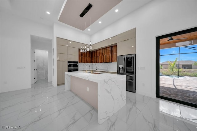 13 NW 14th Ave, Cape Coral, FL 33993 - kitchen featuring modern cabinets, black fridge, a chandelier, a large island, and recessed lighting