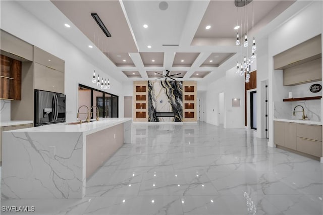 13 NW 14th Ave, Cape Coral, FL 33993 - kitchen with modern cabinets, fridge with ice dispenser, light marble finish floors, a sink, and recessed lighting