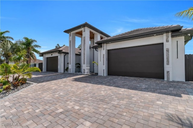 13 NW 14th Ave, Cape Coral, FL 33993 - view of front of home with an attached garage and decorative driveway