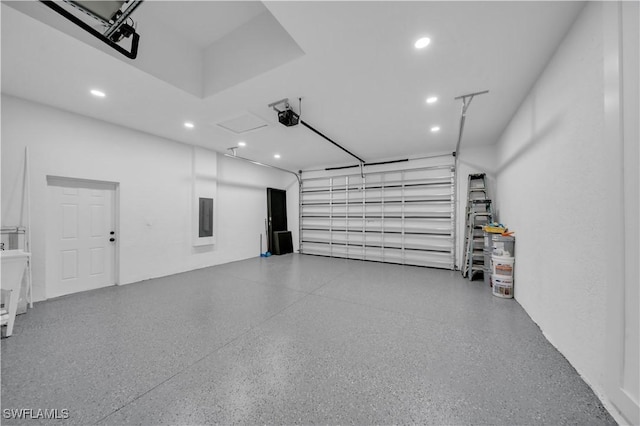 13 NW 14th Ave, Cape Coral, FL 33993 - garage with recessed lighting, a garage door opener, and electric panel