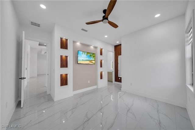 13 NW 14th Ave, Cape Coral, FL 33993 - spare room with light marble finish floors, a ceiling fan, recessed lighting, and baseboards