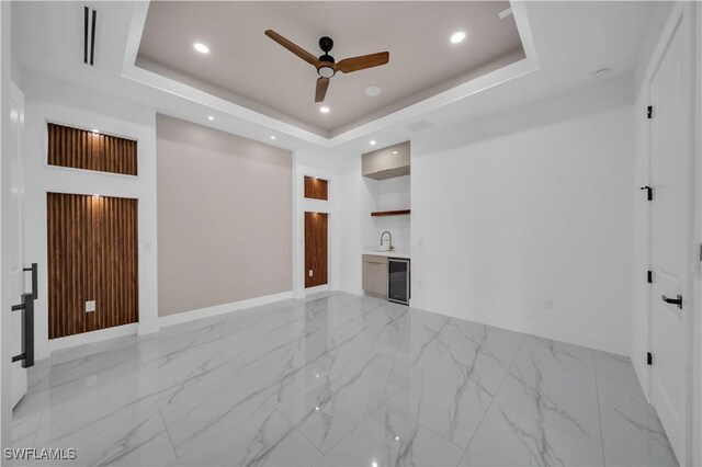 13 NW 14th Ave, Cape Coral, FL 33993 - unfurnished living room with baseboards, ceiling fan, light marble finish floors, and recessed lighting